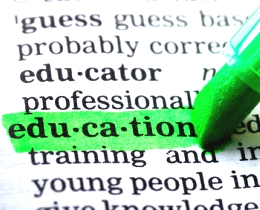 Image of the word education being highlighted in a dictionary